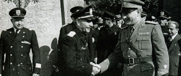 Albanian Prime Minister Shefqet bey Vërlaci (centre) shaking hands with Regent Francesco Jacomoni di San Savino (right).